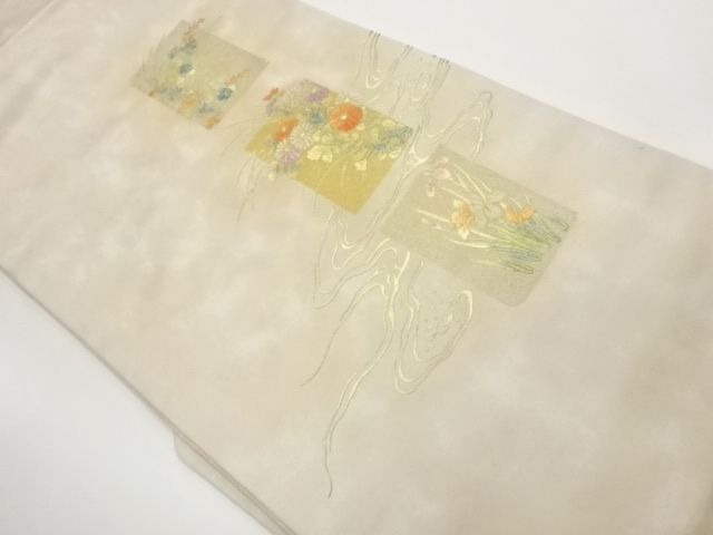 金彩色紙に流水・草花模様名古屋帯